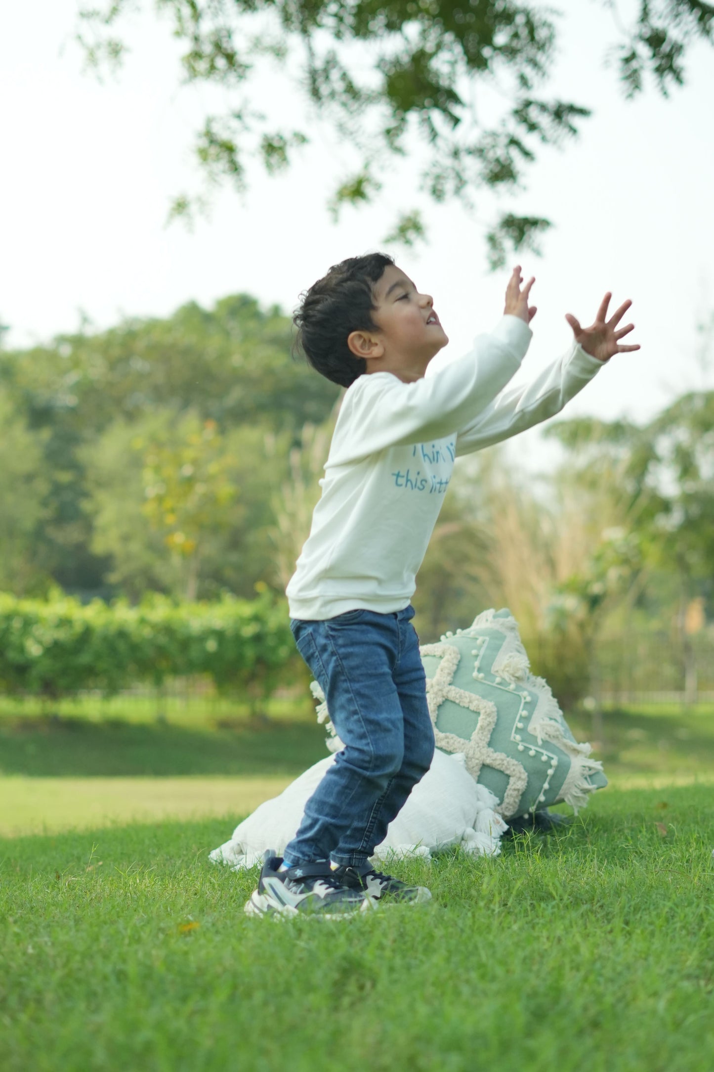 Person lying on a grassy field with a blurred background