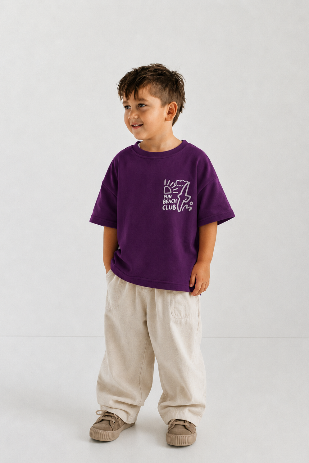 Child wearing a purple t-shirt with text on a white background