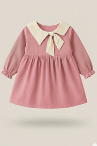 Pink dress with a white collar and bow on a beige background