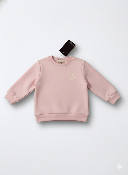Pink sweatshirt on a white background