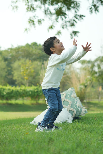 Person lying on a grassy field with a blurred background