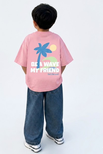 Child wearing a pink t-shirt with a palm tree design and text on the back, standing against a white background.