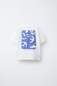 White t-shirt with blue bird pattern on a white background