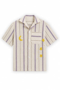 Beige shirt with purple stripes and embroidered stars and moon on a white background