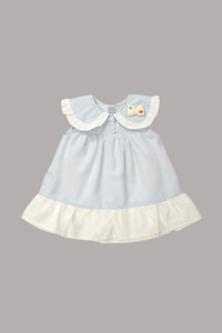Light blue dress with white collar and hem on a white background