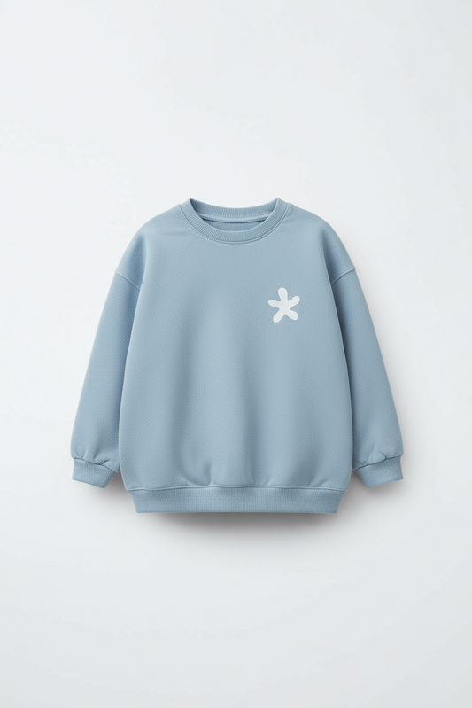 Light blue sweatshirt with a white flower design on a light gray background