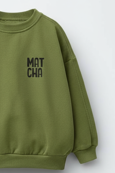 Green sweatshirt with 'MAT CHA' text on a white background